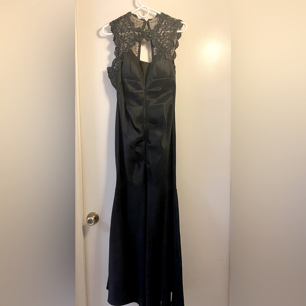 Beautiful black dress size Large but fits like a medium